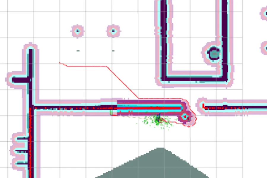 Detail of the costmap with the planned path drawn as a thin red line: it runs flat to the right, breaks into a 45-degree diagonal at a sharp corner, and meets the corridor mouth.